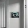 Painting of abstract body shapes in pastels on a light gray wall between doors