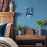 Vintage-style bedroom with a wooden bed, blue wall, and a painting of a female nude in cool tones, decorated with plants and antique details