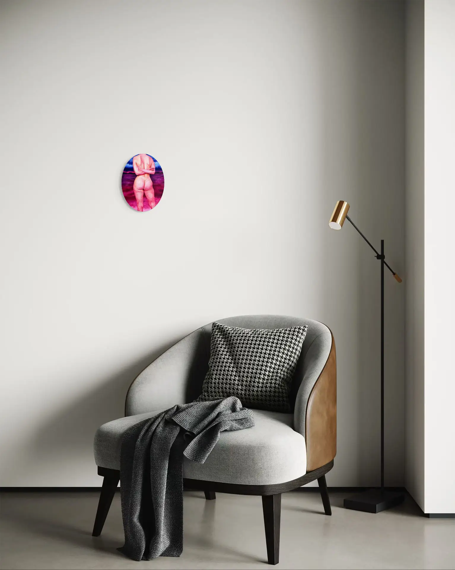 Oval painting of a female nude against a pink and violet landscape, hanging above an armchair