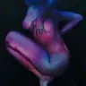 Jagoda Laprus. Oil painting 18x13cm. A crouching nude woman in profile with hands resting by her sides – an oil nude in purple, navy, and pink