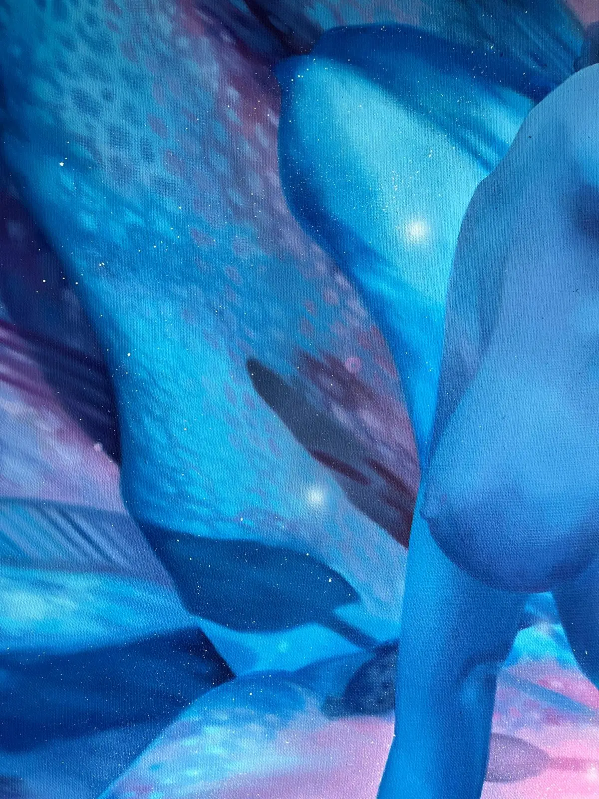 Detail of a blue female nude against abstract flower petals in turquoise and pink.