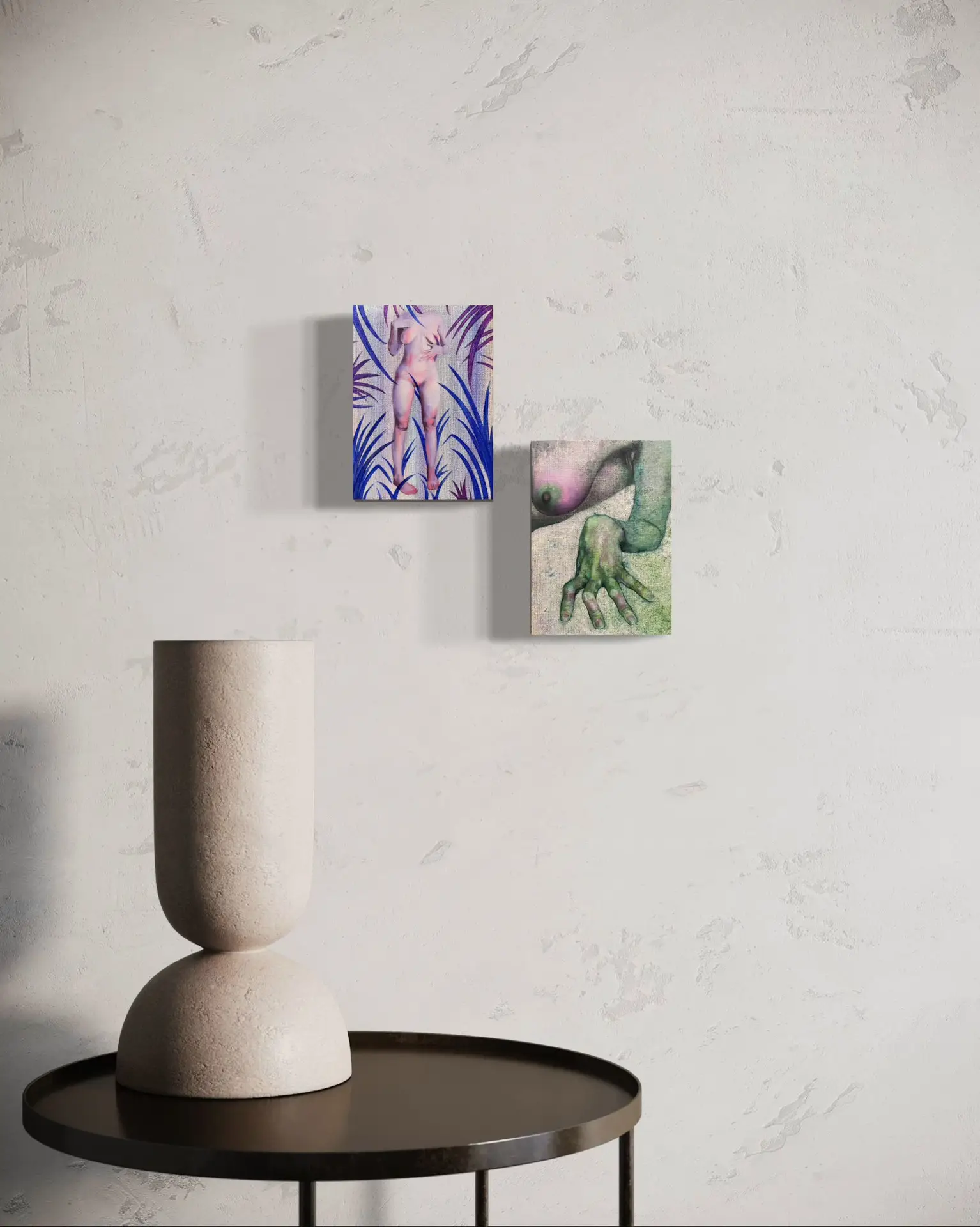 Visualization of two modern surrealist paintings hung on a light wall above a round table with a minimalist sculpture; on the left a painting of a nude figure among blue plants, on the right a painting depicting a female body and a green hand