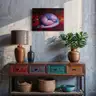 Painting with pink leaves and fragments of a female body, hanging in a bright interior