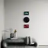 Set of nude paintings in red, green, and navy above a designer marble bench
