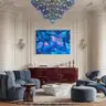 Blue female nude painting in an elegant living room with wall moulding and designer furniture.