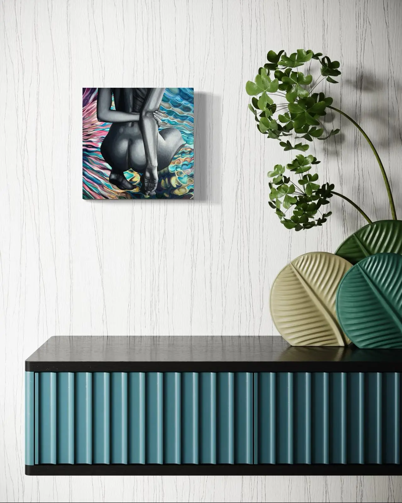 Painting of a female body on a colorful wave background above a blue cabinet with plants