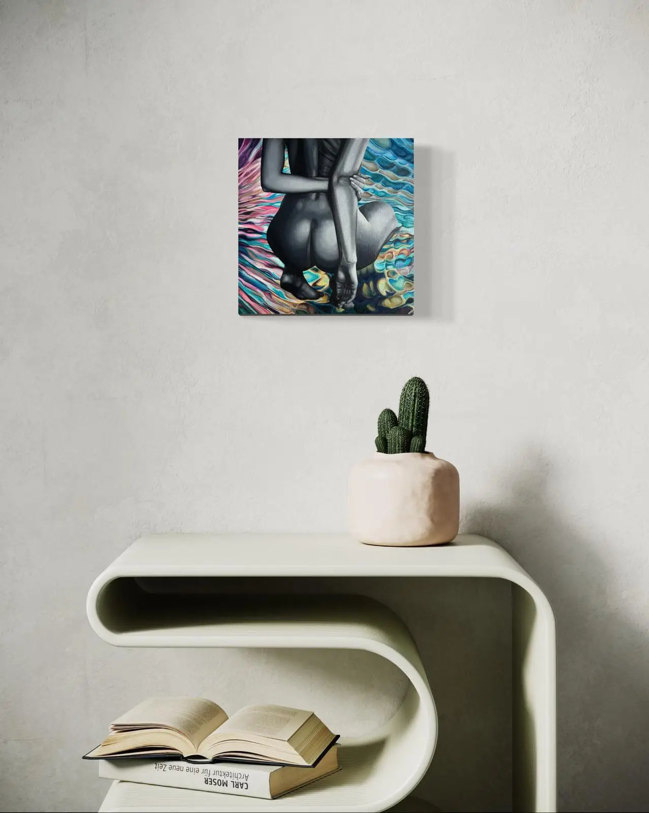 Modern painting of a female nude in grays above a designer table with a cactus