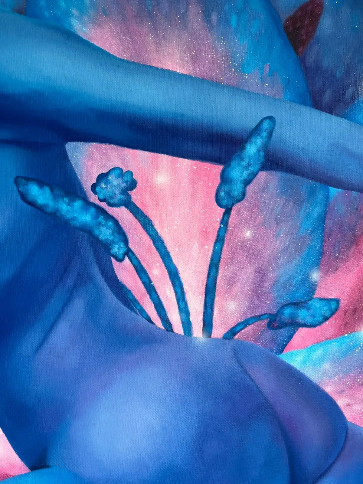 Detail of a blue female nude and flower stamens against a pink and turquoise cosmic background.