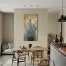 Surrealist painting with a bird figure in a modern dining room