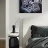 Minimalist home office with surreal painting on the wall