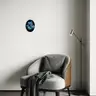 Modern interior with a turquoise wall and a yellow console, decorated with an oval oil painting in cool tones, depicting a female nude against a dark geometric background, by Jagoda Laprus