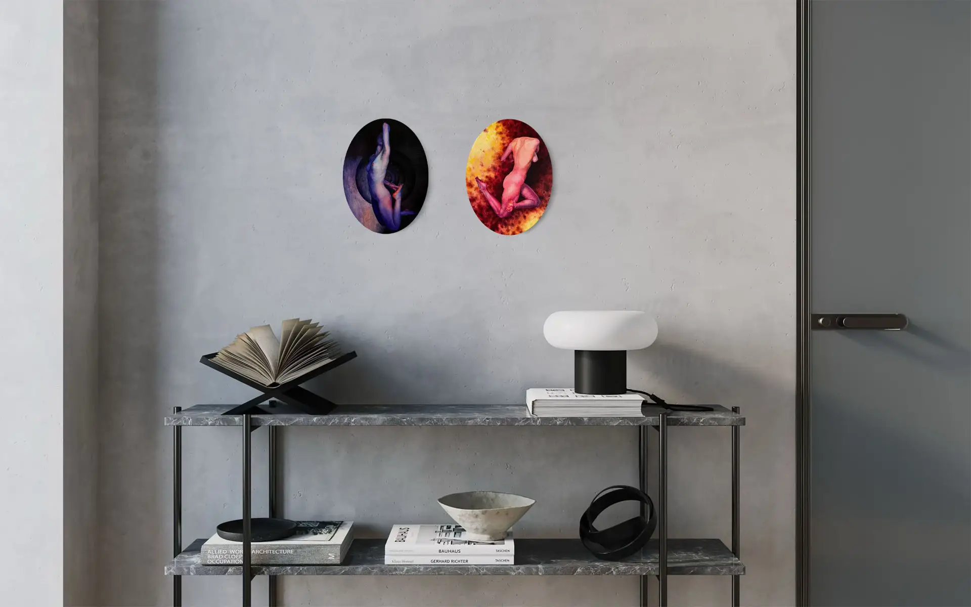 Two oval paintings of nudes in vivid colors, hanging on a concrete wall in a modern interior