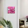 Pink artwork with botanical motif and female silhouette in a classic interior